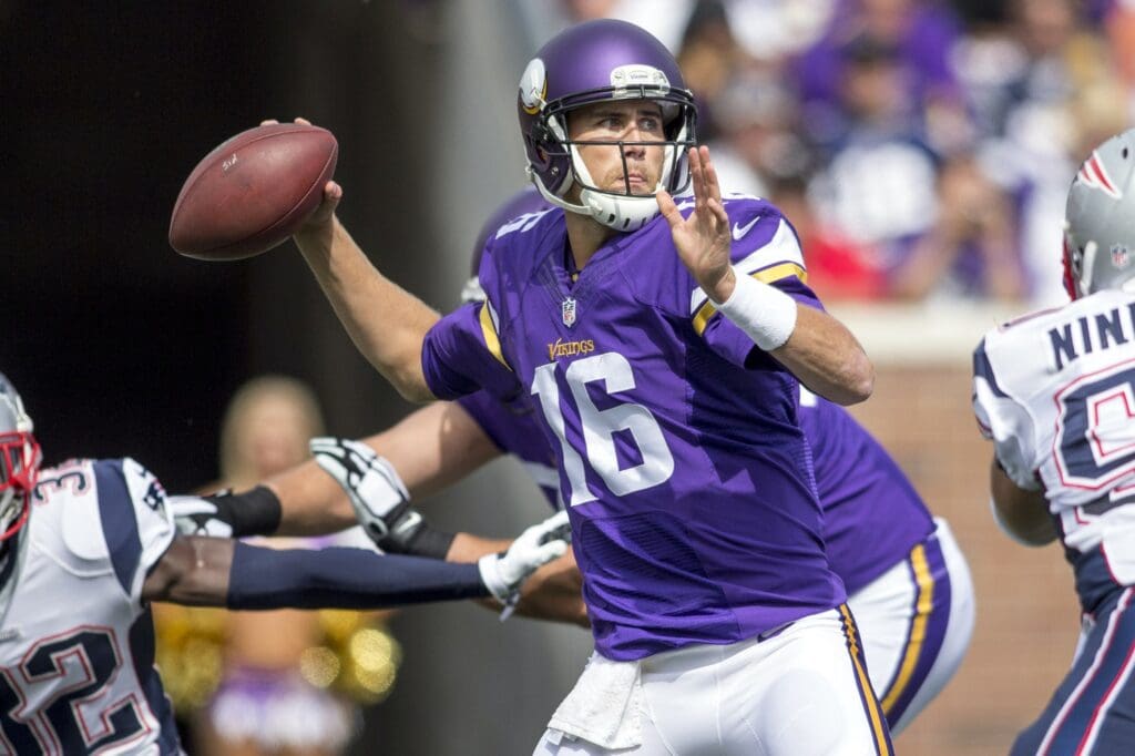 Sep 14, 2014; Minneapolis, MN, USA; Minnesota Vikings quarterback Matt Cassel (16) passes against the New England Patriots in the second quarter at TCF Bank Stadium. The Patriots win 30-7. 