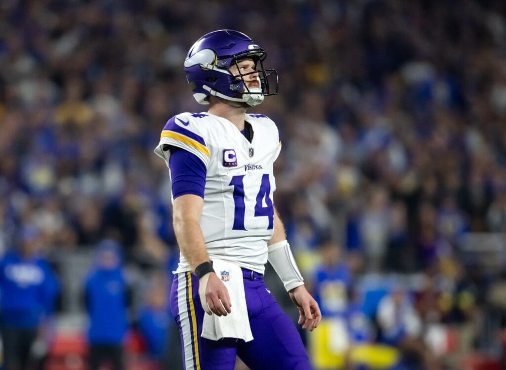 Jan 13, 2025; Glendale, AZ, USA; Minnesota Vikings quarterback Sam Darnold (14) reacts against the Los Angeles Rams in the second half during an NFC wild card game at State Farm Stadium