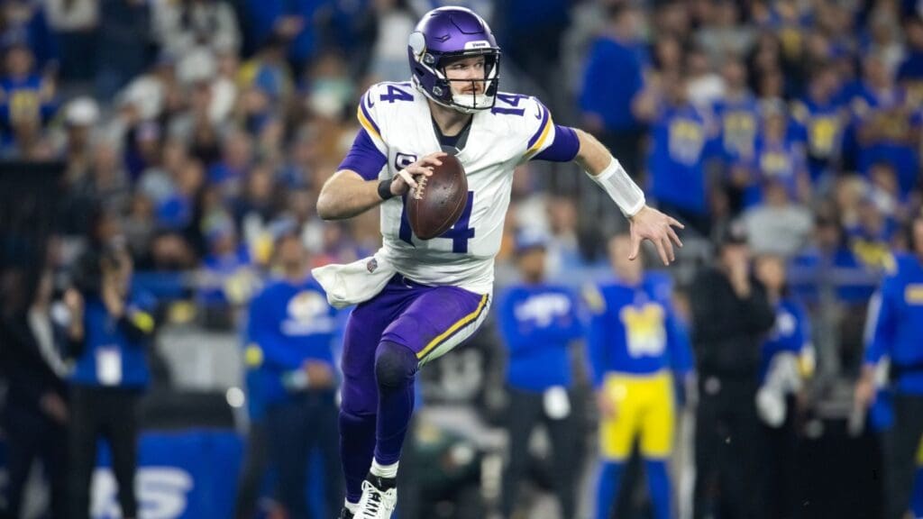 Jan 13, 2025; Glendale, AZ, USA; Minnesota Vikings quarterback Sam Darnold (14) against the Los Angeles Rams during an NFC wild card game at State Farm Stadium.