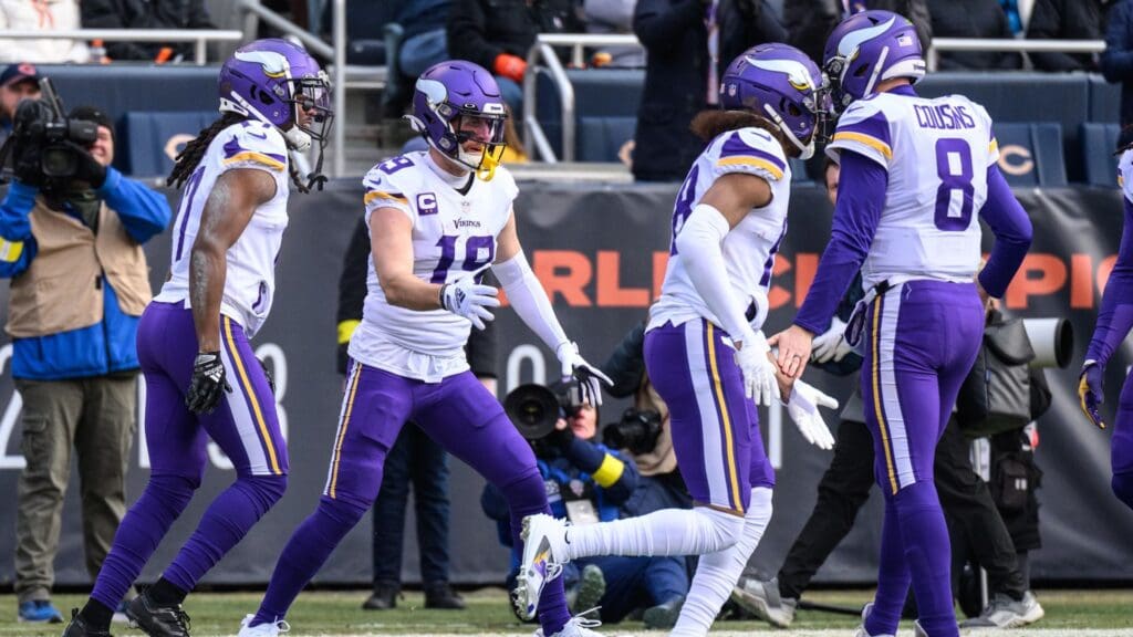 Jan 8, 2023; Chicago, Illinois, USA; Minnesota Vikings wide receiver Adam Thielen (19) celebrates his touchdown reception during the first quarter against the Chicago Bears at Soldier Field