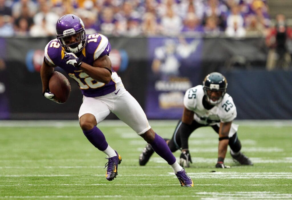 Sep 9, 2012; Minneapolis, MN, USA; Minnesota Vikings wide receiver Percy Harvin (12) carries the ball during the second quarter against the Jacksonville Jaguars at the Metrodome.