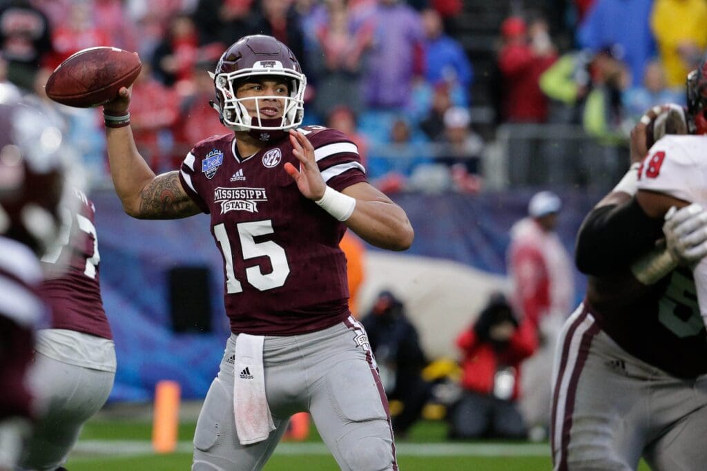 Dec 30, 2015; Charlotte, NC, USA; Mississippi State Bulldogs quarterback Dak Prescott (15) throws a pass during the first quarter against the North Carolina State Wolfpack in the 2015 Belk Bowl at Bank of America Stadium