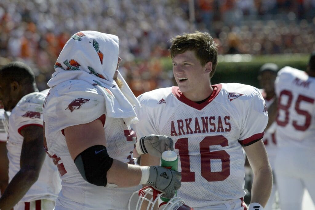 Oct 7, 2006; Auburn, AL, USA. Arkansas Razorbacks quarterback Mitch Mustain (16) and offensive lineman Stephen Parker (74) enjoy the last few minutes of the fourth quarter in Jordan Hare Stadium in Auburn. Mustain completed 7 passes for 87 yards as the Razorbacks upset the Auburn Tigers 27-10.
