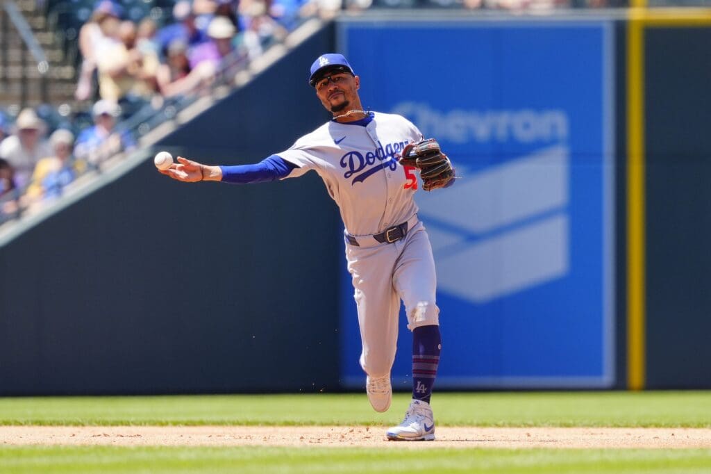 Jun 26, 2025; Denver, Colorado, USA; Los Angeles Dodgers shortstop Mookie Betts (50) fields the ball fifth inning against the Colorado Rockies at Coors Field.