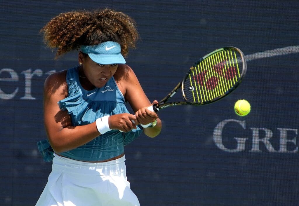 Naomi Osaka returns a hit to Ashlyn Krueger Cincinnati Open at the Lindner Family Tennis Center in Mason Monday, August 12, 2024. Krueger won 6,-3, 2-6,6-3.