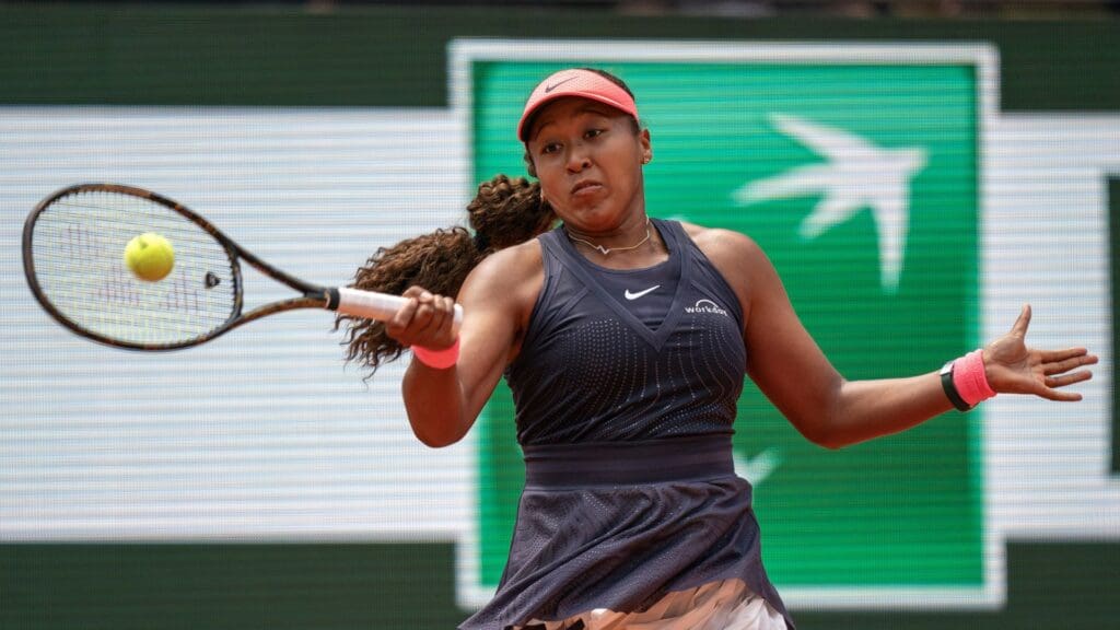 May 26, 2024; Paris, France; Naomi Osaka of Japan returns a shot in her first round match against Lucia Bronzetti of Italy on day one of Roland Garros at Stade Roland Garros