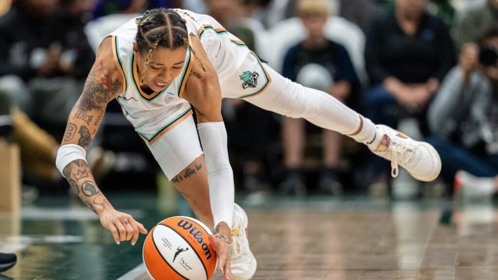 Jun 22, 2025; Seattle, Washington, USA; New York Liberty guard Natasha Cloud (9) dives for a loose ball during the second half against the Seattle Storm at Climate Pledge Arena.