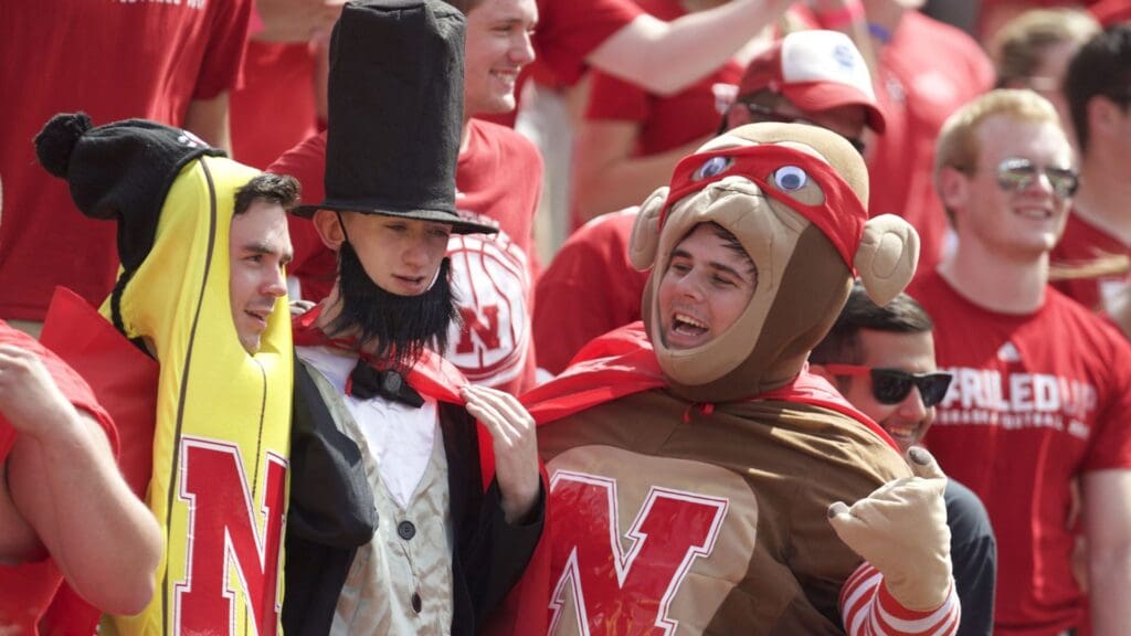 Sep 5, 2015; Lincoln, NE, USA; Nebraska Cornhuskers fans cheer from the stands against the Brigham Young Cougars in the first half at Memorial Stadium.