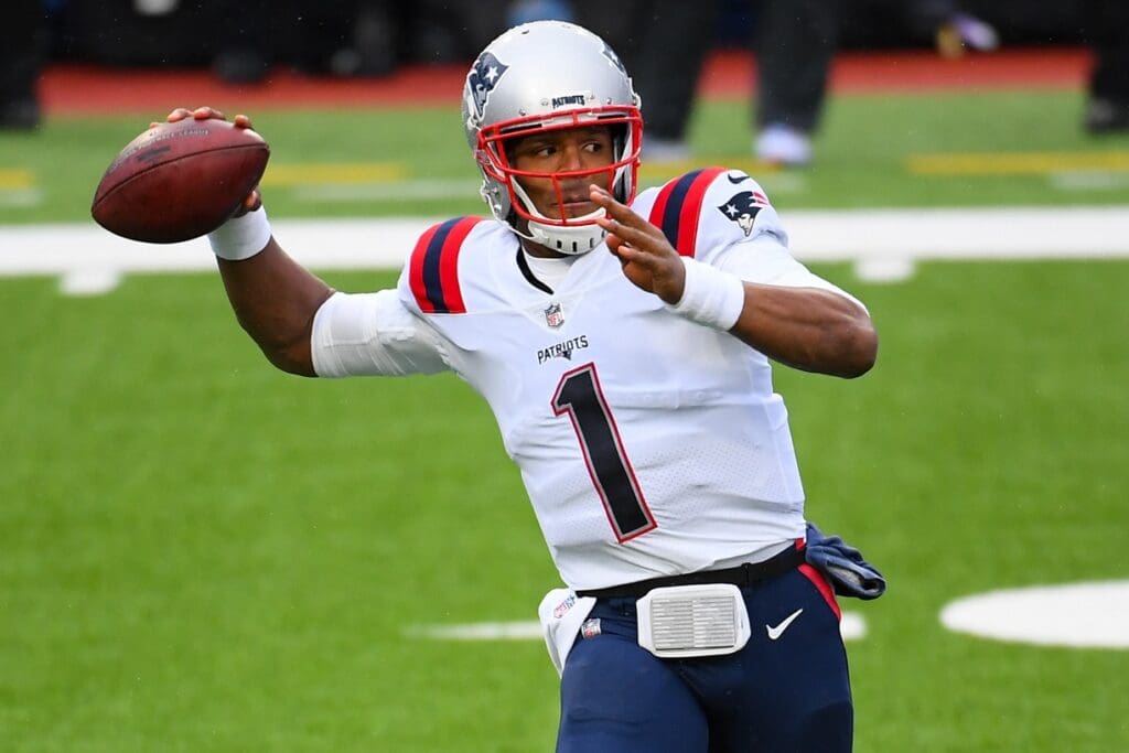 Nov 1, 2020; Orchard Park, New York, USA; New England Patriots quarterback Cam Newton (1) passes the ball against the Buffalo Bills during the first quarter at Bills Stadium.