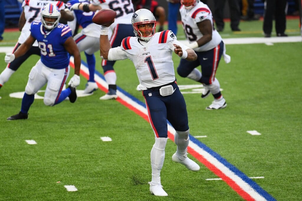 Nov 1, 2020; Orchard Park, New York, USA; New England Patriots quarterback Cam Newton (1) passes the ball against the Buffalo Bills during the third quarter at Bills Stadium.