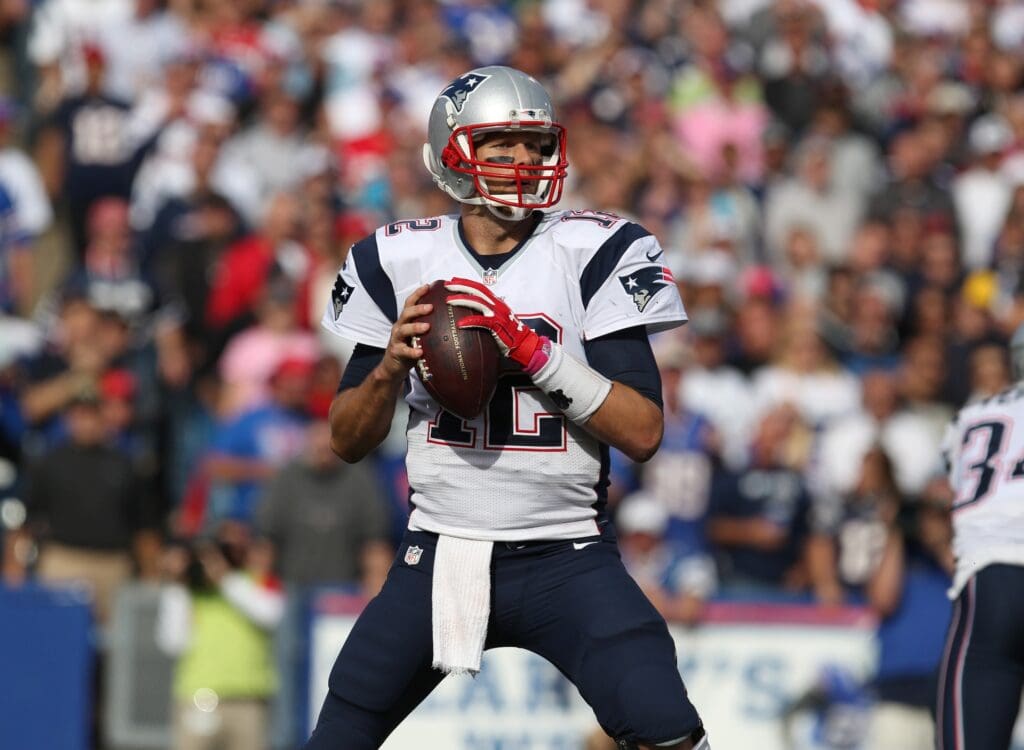 Oct 12, 2014; Orchard Park, NY, USA; New England Patriots quarterback Tom Brady (12) looks to make a pass during the second half against the Buffalo Bills at Ralph Wilson Stadium. New England beats Buffalo 37 to 22.