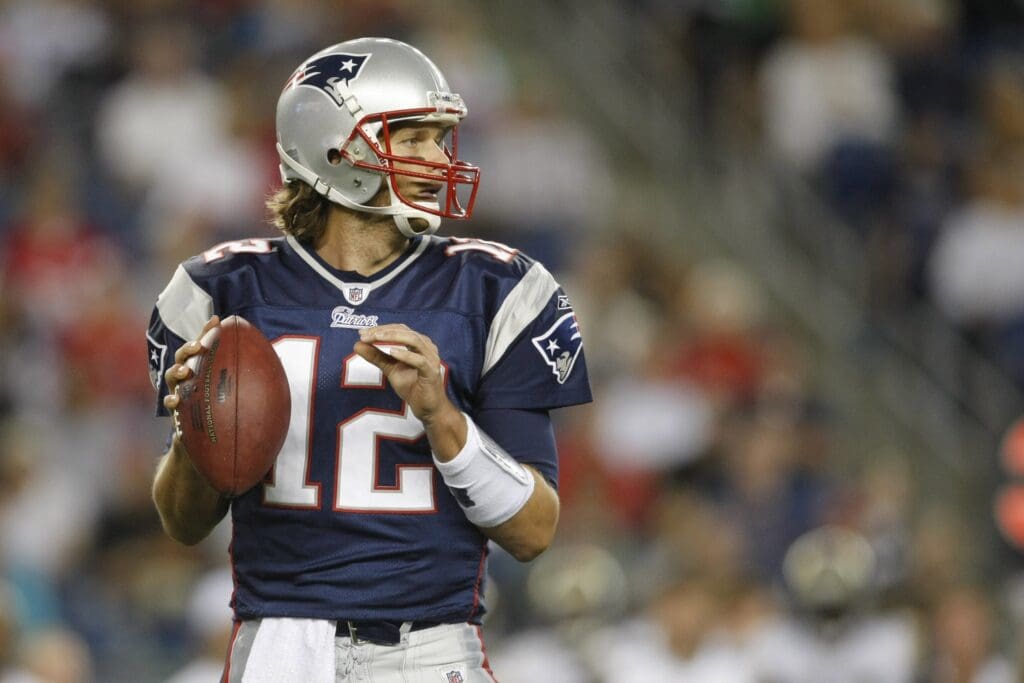 Aug 26, 2010; Foxboro, MA, USA; New England Patriots quarterback Tom Brady (12) looks to pass against the St. Louis Rams during the pre-season game's first quarter at Gillette Stadium.