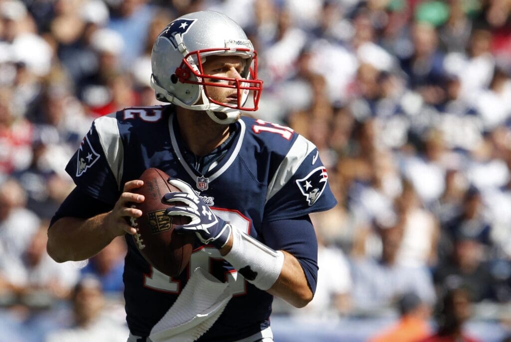 Sep 16, 2012; Foxborough, MA, USA; New England Patriots quarterback Tom Brady (12) throws a pass against the Arizona Cardinals during the first quarter at Gillette Stadium.