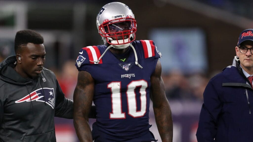 Oct 10, 2019; Foxborough, MA, USA; New England Patriots wide receiver Josh Gordon (10) is helped off of the field during the first half against the New York Giants at Gillette Stadium.