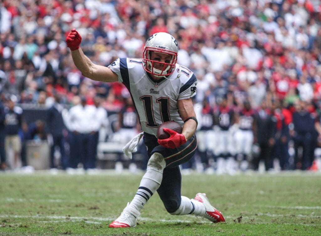 Dec 1, 2013; Houston, TX, USA; New England Patriots wide receiver Julian Edelman (11) reacts after making a reception during the fourth quarter against the Houston Texans at Reliant Stadium. The Patriots defeated the Texans 34-31.