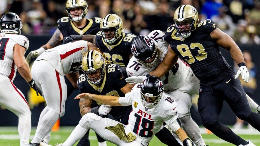 Nov 10, 2024; New Orleans, Louisiana, USA; New Orleans Saints defensive end Chase Young (99) forces a fumble by New Orleans Saints quarterback Spencer Rattler (18) as he is sacked during the second half at Caesars Superdome.