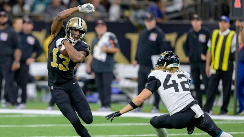 Oct 19, 2023; New Orleans, Louisiana, USA; New Orleans Saints wide receiver Michael Thomas (13) runs after a reception against Jacksonville Jaguars safety Andrew Wingard (42) during the fourth quarter at the Caesars Superdome.