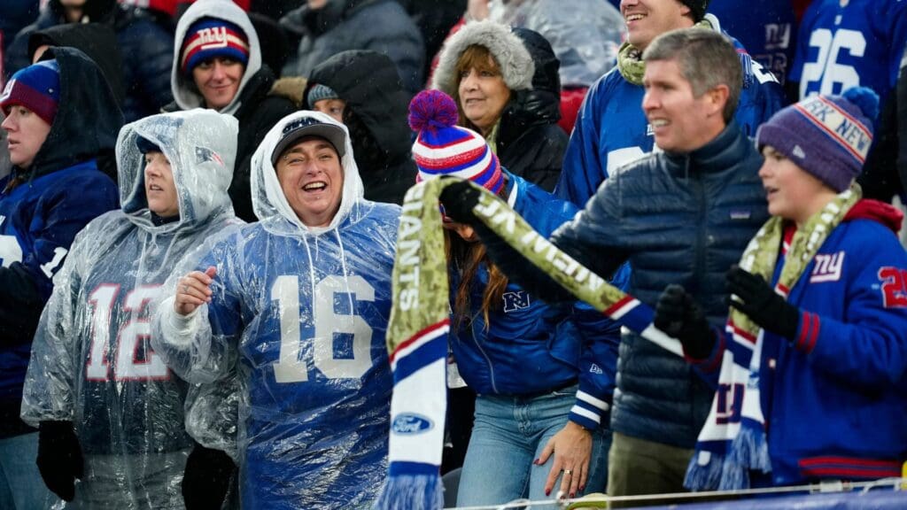 New York Giants fans celebrated after New England Patriots place kicker Chad Ryland (not shown) failed to kick a field goal with five seconds left in the game. The field goal attempt would have tied the game. Instead, the New York Giants were victorious, 10-7, Sunday, November 26, 2023.