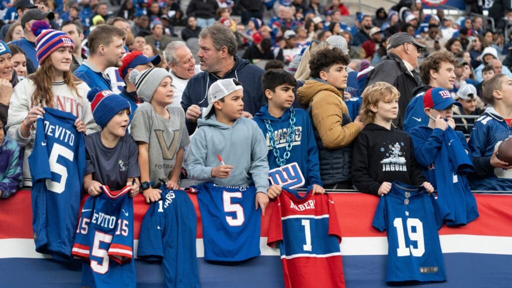 New York Giants fans ask players for their autographs after the game between New York Giants and Indianapolis Colts at MetLife Stadium on Sunday, Dec. 29, 2024