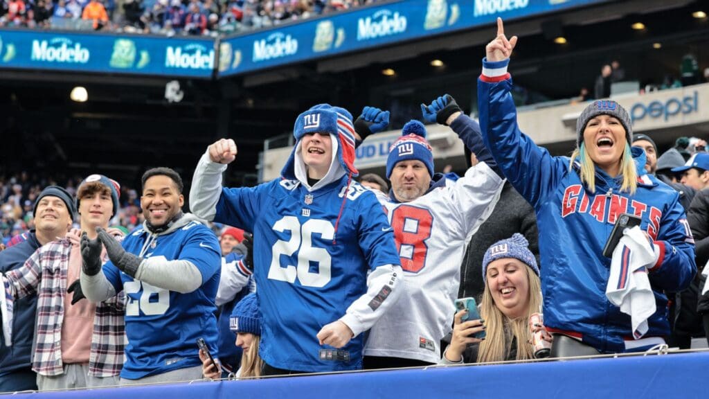 Nov 28, 2021; East Rutherford, New Jersey, USA; New York Giants fans celebrate after a Giants interception against the Philadelphia Eagles during the first half at MetLife Stadium.