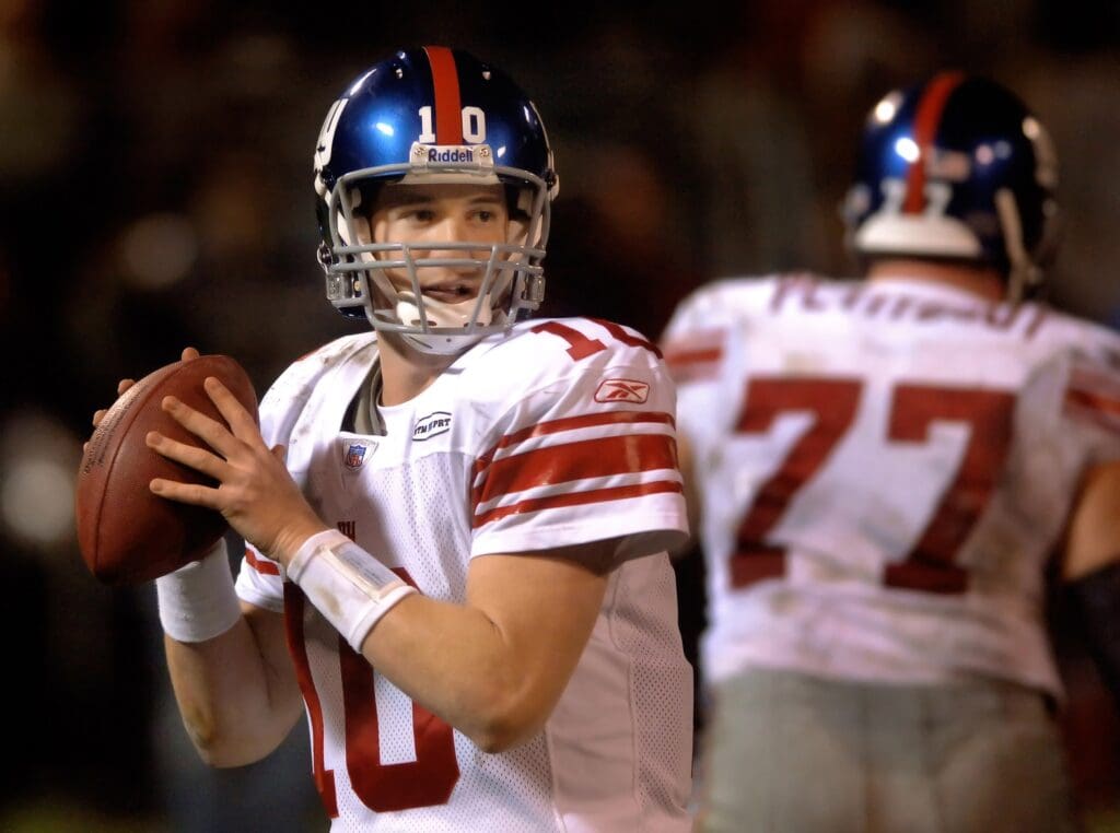 Dec. 31, 2005; Oakland, Calif, USA; New York Giants quarterback (10) Eli Manning drops back to pass the ball against the Oakland Raiders in the fourth quarter at McAfee Coliseum.