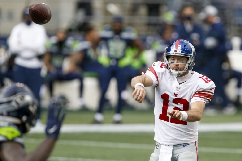 Dec 6, 2020; Seattle, Washington, USA; New York Giants quarterback Colt McCoy (12) passes against the Seattle Seahawks during the first quarter at Lumen Field.