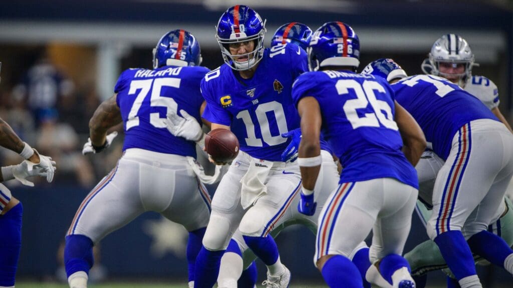 Sep 8, 2019; Arlington, TX, USA; New York Giants quarterback Eli Manning (10) and running back Saquon Barkley (26) in action during the game between the Cowboys and the Giants at AT&T Stadium