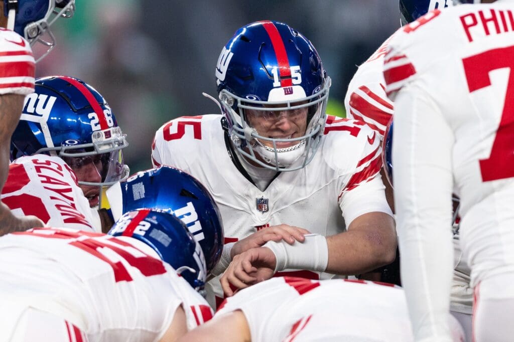 Dec 25, 2023; Philadelphia, Pennsylvania, USA; New York Giants quarterback Tommy DeVito (15) calls a play in the huddle during the first quarter against the Philadelphia Eagles at Lincoln Financial Field