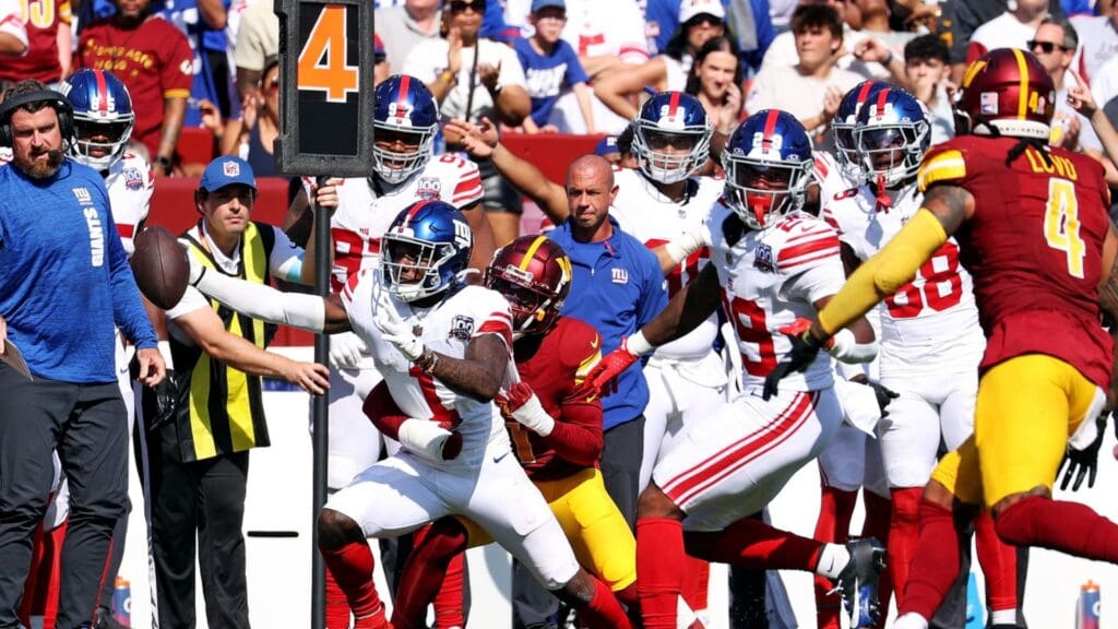Sep 15, 2024; Landover, Maryland, USA; New York Giants wide receiver Malik Nabers (1) reaches for a first down during the fourth quarter against the Washington Commanders at Commanders Field.