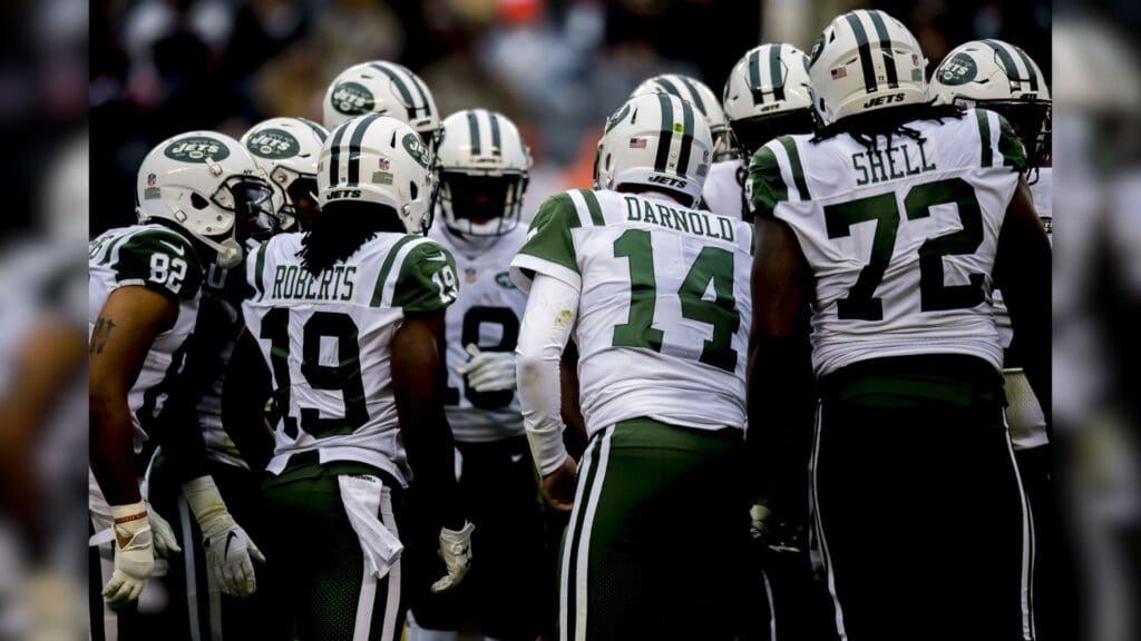 Oct 28, 2018; Chicago, IL, USA; New York Jets quarterback Sam Darnold (14) chats with his team during the second half against the Chicago Bears at Soldier Field.