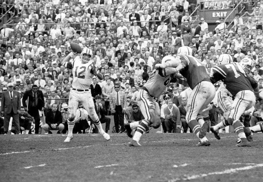 Jan 12, 1969; Miami, FL, USA; FILE PHOTO; New York Jets quarterback (12) Joe Namath throws a pass against the Baltimore Colts during Super Bowl III at the Orange Bowl. Namath was named the games most valuable player as the Jets defeated the Colts 16-7 to win their 1st Super Bowl title and giving the AFL the first Championship over the NFL.