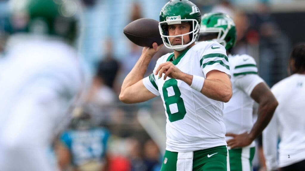 New York Jets quarterback Aaron Rodgers (8) warms up before an NFL football matchup Sunday, Dec. 15, 2024 at EverBank Stadium in Jacksonville, Fla.