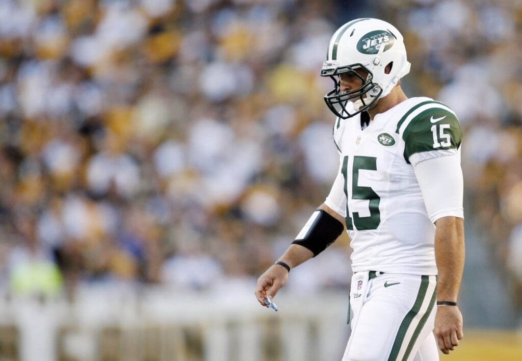 September 16, 2012; Pittsburgh, PA, USA; New York Jets quarterback Tim Tebow (15) walks off the field against the Pittsburgh Steelers during the third quarter at Heinz Field. The Pittsburgh Steelers won 27-10