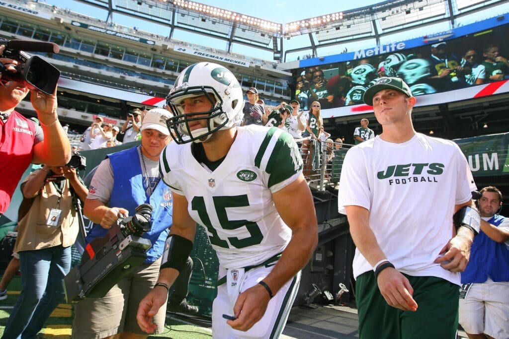 Sept 9, 2012; East Rutherford, NJ, USA; New York Jets quarterback Tim Tebow (15) runs onto the field during the pre-game warmup for their game against the Buffalo Bills at MetLIfe Stadium.