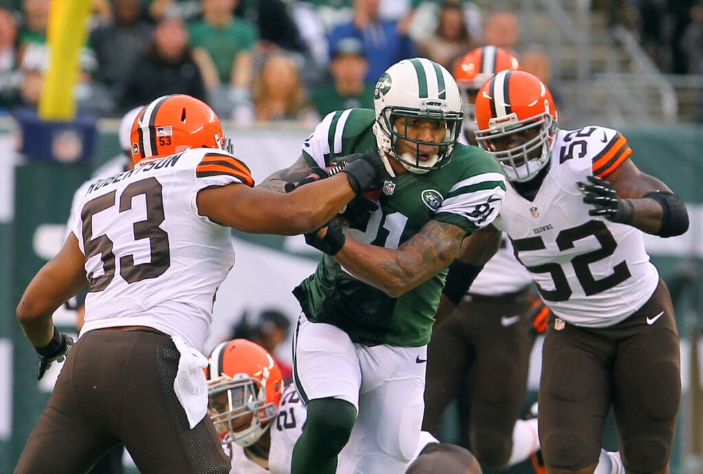 Dec 22, 2013; East Rutherford, NJ, USA; New York Jets tight end Kellen Winslow (81) runs with the ball past Cleveland Browns inside linebacker Craig Robertson (53) and inside linebacker D'Qwell Jackson (52) during the first half at MetLife Stadium.