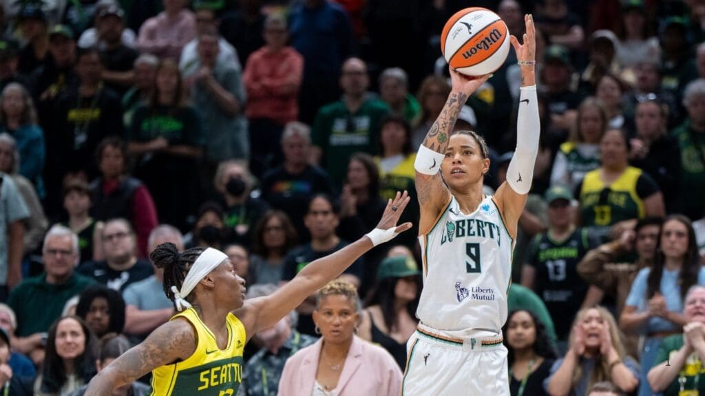 Jun 22, 2025; Seattle, Washington, USA; New York Liberty guard Natasha Cloud (9) shoots the ball against Seattle Storm guard Erica Wheeler (17) during the second half at Climate Pledge Arena.