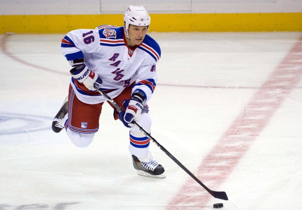 Jan 8, 2010; St. Louis, MO, USA; New York Rangers left wing Sean Avery (16) controls the puck against the St. Louis Blues during the third period at the Scottrade Center. The Rangers defeated the Blues 2-1.