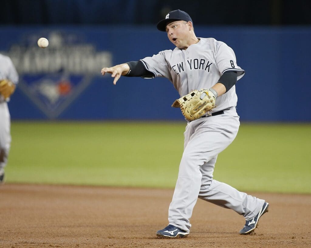 Sep 23, 2016; Toronto, Ontario, CAN; New York Yankees first baseman Billy Butler (36) commits a fielding error on a bad throw back to first base on at hit by Toronto Blue Jays third baseman Josh Donaldson (not pictured) during the first inning Rogers Centre.