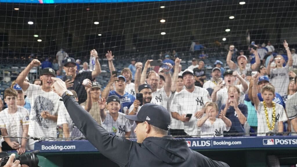 Oct 10, 2024; Kansas City, Missouri, USA; New York Yankees manager Aaron Boone (17) raises his hands to fans following a win over the Kansas City Royals during game four of the ALDS for the 2024 MLB Playoffs at Kauffman Stadium