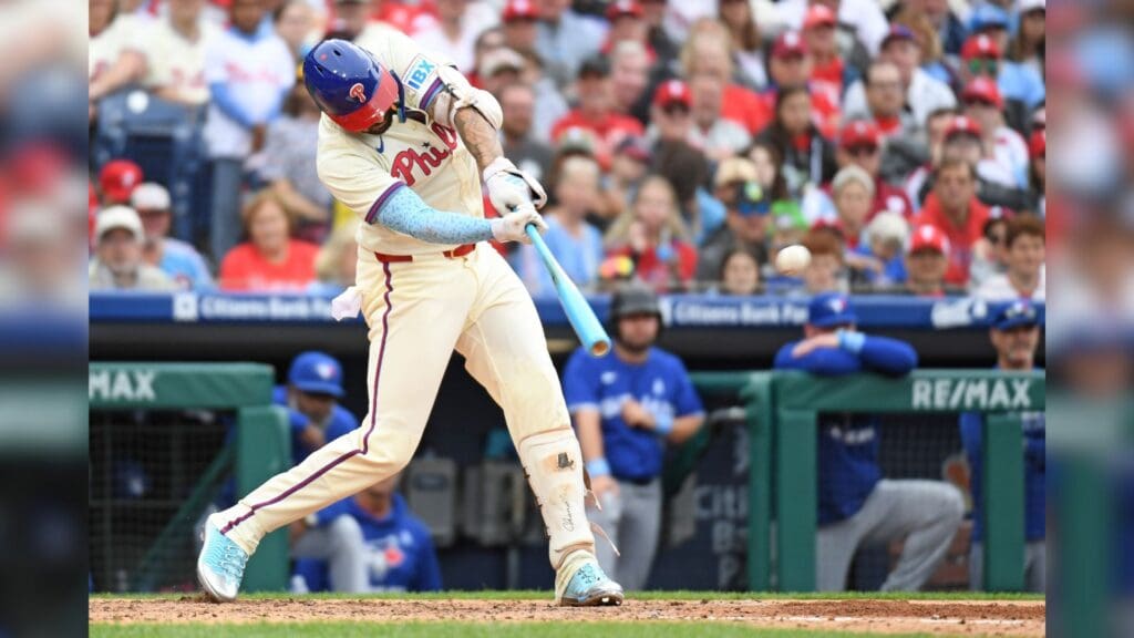 Jun 15, 2025; Philadelphia, Pennsylvania, USA; Philadelphia Phillies outfielder Nick Castellanos (8) hits a grand slam home run during the sixth inning against the Toronto Blue Jays at Citizens Bank Park.