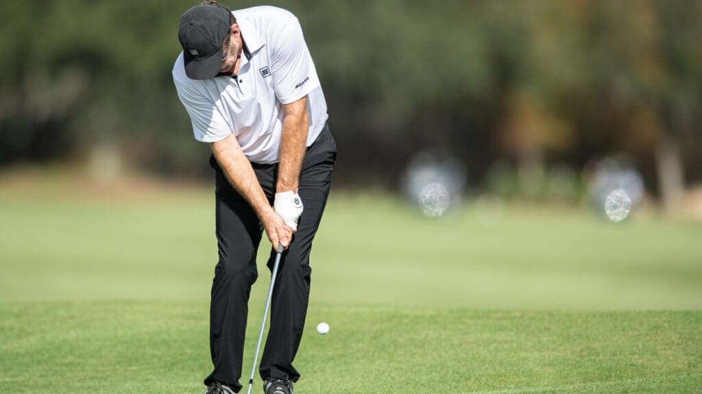 Dec 16, 2021; Orlando, Florida, USA; Nick Faldo plays his shot on the 18th green during a pro-am round of the PNC Championship golf tournament at Grande Lakes Orlando Course.