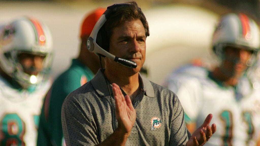 Oct. 30, 2005; Baton Rouge, LA, USA; Miami Dolphins head coach Nick Saban cheers on his dolphins after kicking a field goal against the New Orleans Saints in the first half of action at Tiger Stadium. This game marked Saban's return to Louisiana State University where he led the Tigers to a national championship. This was the Saints first game in Louisiana at Louisiana State University since Hurricane Katrina.