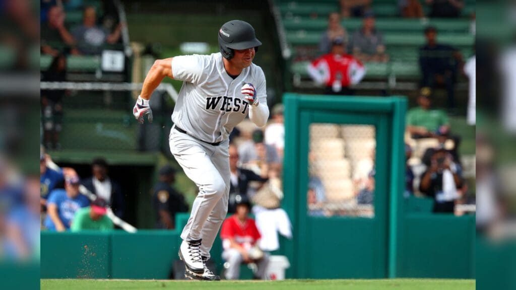 Jun 19, 2025; Birmingham, AL, USA; West team outfielder Nick Swisher (33) sprints to first base during the East-West Classic at Rickwood Field.