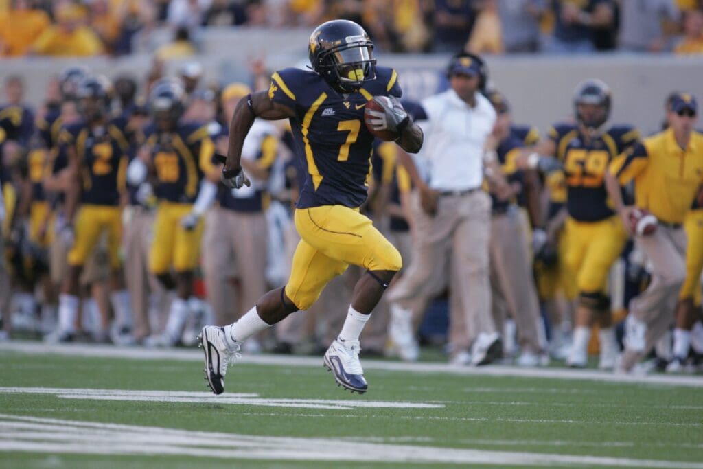 October 9, 2010; Morgantown,WV, USA; West Virginia Mountaineers running back Noel Devine (7) scores on a 52 yard touchdown in the 2nd quarter against UNLV Runnin Rebels at Mountaineer Field at Milan Puskar Stadium. West Virginia Mountaineers defeated UNLV Runnin Rebels 49-10.