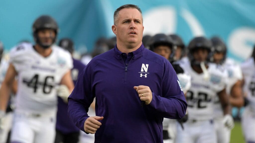 Dec 31, 2018; San Diego, CA, United States; Northwestern Wildcats head coach Pat Fitzgerald runs onto the field during the 2018 Holiday Bowl against the Utah Utes at SDCCU Stadium.