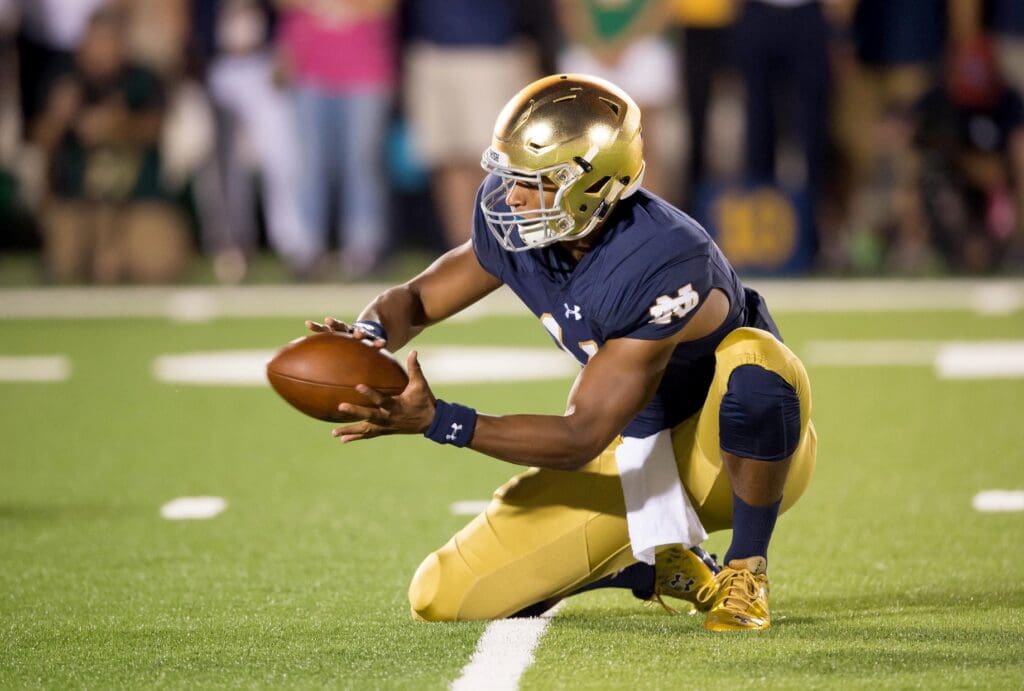 Sep 5, 2015; South Bend, IN, USA; Notre Dame Fighting Irish quarterback DeShone Kizer (14) handles the snap as holder on a place kick in the fourth quarter against the Texas Longhorns at Notre Dame Stadium. Notre Dame won 38-3.