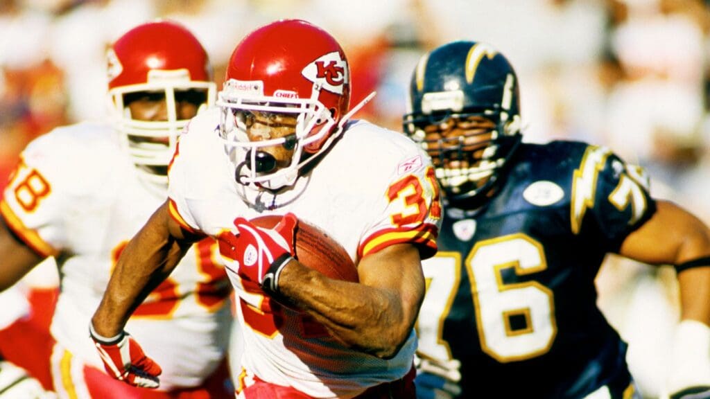 Kansas City Chiefs running back Priest Holmes (31) pursued by San Diego Chargers defense tackle Jamal Williams (76) at Qualcomm Stadium.