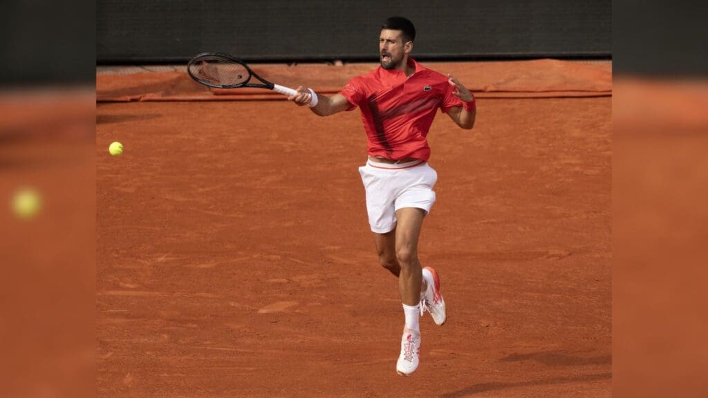 Jun 2, 2025; Paris, FR; Novak Djokovic of Serbia returns a shot during his match against Cameron Norrie of Great Britain on day nine at Roland Garros Stadium.