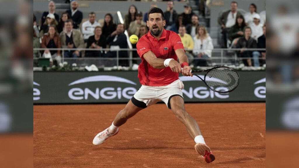 Jun 6, 2025; Paris, FR; Novak Djokovic of Serbia returns a shot during his match against Jannik Sinner of Italy on day 13 at Roland Garros Stadium.