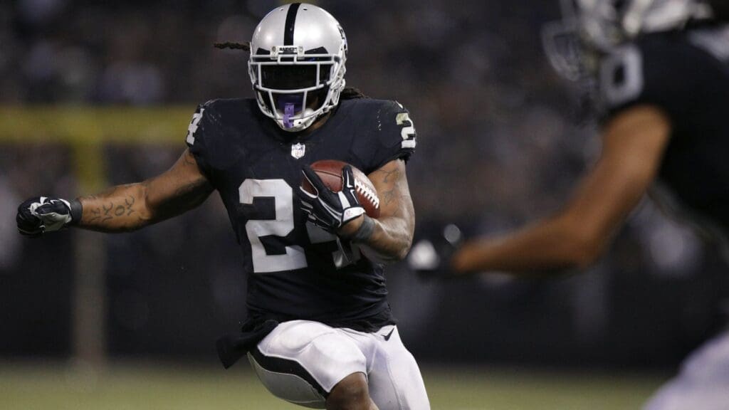 Dec 17, 2017; Oakland, CA, USA; Oakland Raiders running back Marshawn Lynch (24) runs the ball against the Dallas Cowboys in the third quarter at Oakland Coliseum.